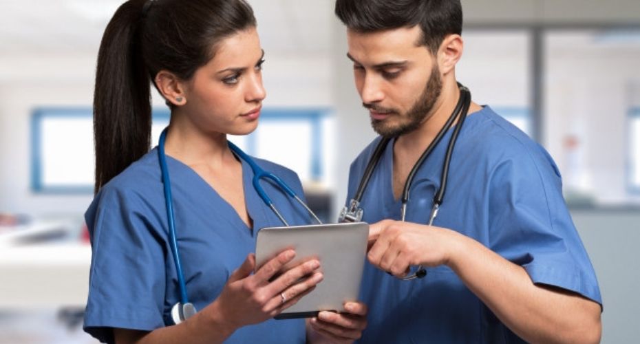 doctors using digital tablet