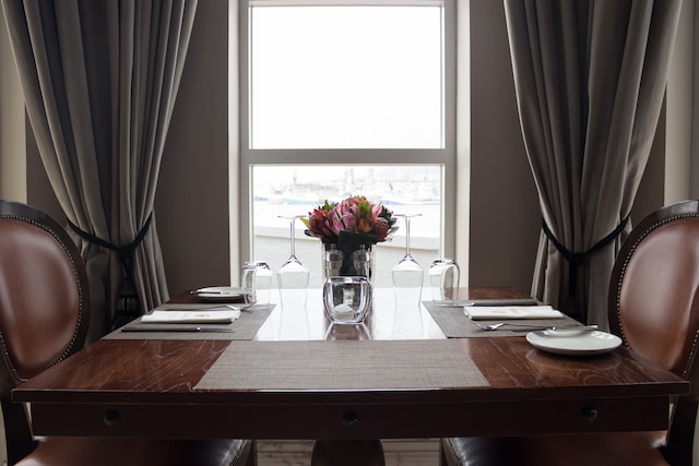 living room table next to window with beautiful blinds